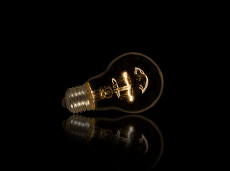 Lightbulb on isolated black background