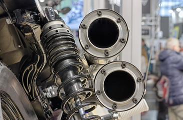 Close up exhaust  of motorcycle, indoor photo.