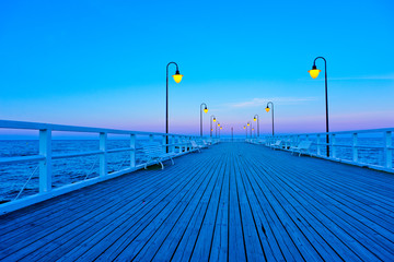 Beautiful wooden pier at sunset