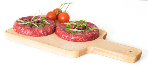 Raw beef hambuger isolated on white background