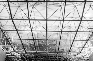 Fototapeta premium Steel construction of an airport terminal at night, HDR Structure of steel frame construction. Frankfurt Airport Terminal 2. Monochrome 