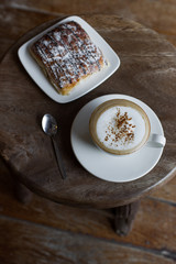 Aroma cappuccino with chocolate croissant on the round vintage w