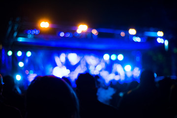 Intentionally blurred people viewing live concert