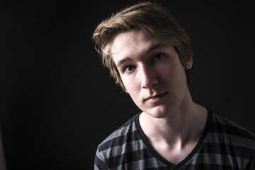 teenager portrait isolated on black background