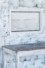 White brick textured wall with empty plate