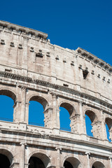 Obraz premium Colosseum part with summer blue sky