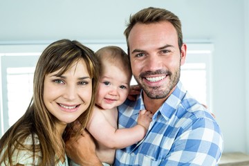 Fototapeta premium Portrait of happy parents with son