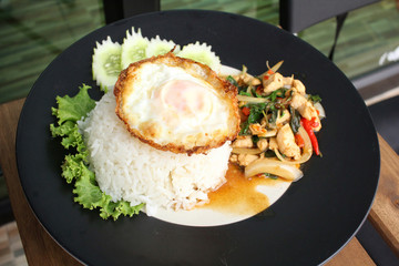Fried pork basil and egg with rice thai food