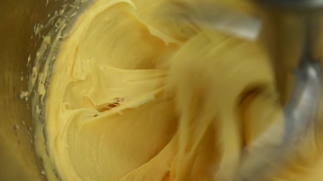 Mixing the choux dough on professional mixer for making French Eclairs