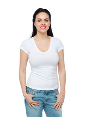 happy young woman or teenage girl in white t-shirt