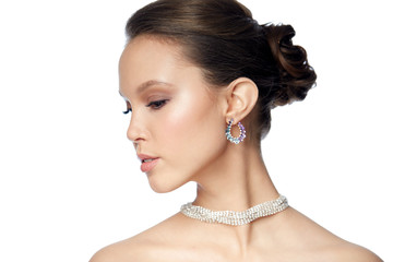 close up of beautiful woman face with earring