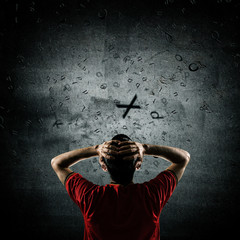 thinking man with flying letters