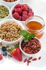 foods for healthy nutrition and fresh berries on white table