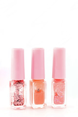 colored nail polish standing isolated on white background