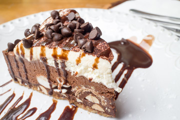 Sweet chocolate ship cake with syrup on the dish
