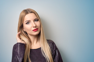 Fototapeta premium Fashion model with bright makeup. Portrait of young fashion woman with long blond hair