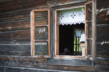 Open window in an old wooden village house