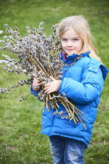 Portrait Girl with a branch of pussy willow. Salix. Easter traditions. © Petr Bonek