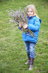Portrait Girl with a branch of pussy willow. Salix. Easter traditions. © Petr Bonek