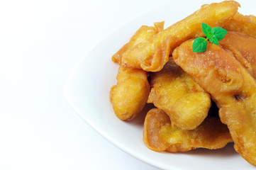 Banana fritters on a plate with copy space