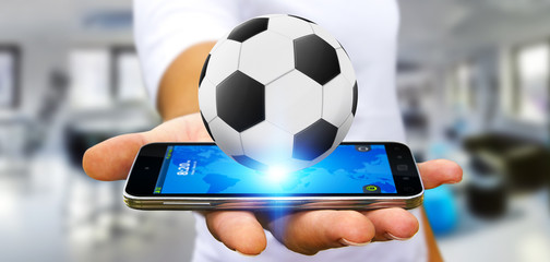 Businessman holding football in his hand