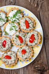 Muffins with smoked salmon pate, cheese and dill.