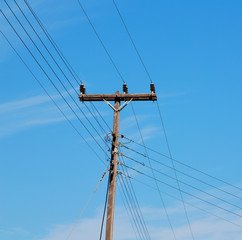 current pole electricity line in the cloudy  sky and abstract ba