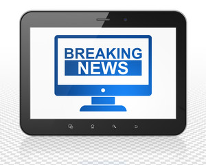 News concept: Tablet Pc Computer with Breaking News On Screen on display