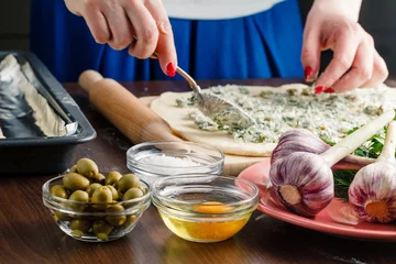 Foto op Canvas Stuffing with olive and garlic french baguette © Andrey Cherkasov