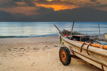 Fishing boat on sandy beach