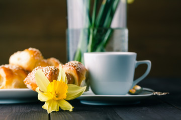 Spring breakfast with pastry and spring flowers
