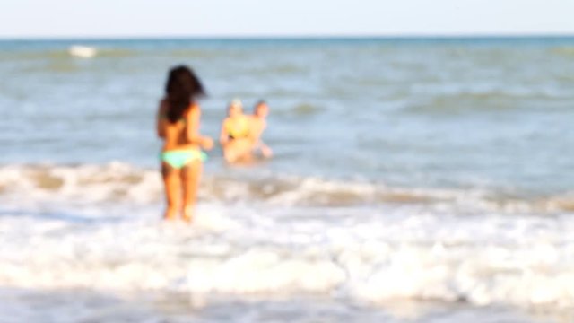 sexy tanned girl in a bikini on the beach