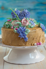 Coffee cake with floral decoration.