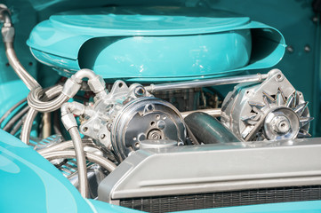 chrome and turquoise blue vehicle engine bay