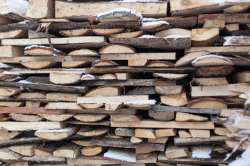 firewood in the snow in the winter