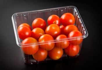 Cherry tomatoes in plastic container