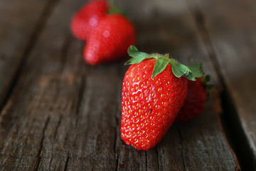 strawberries on a wooden background