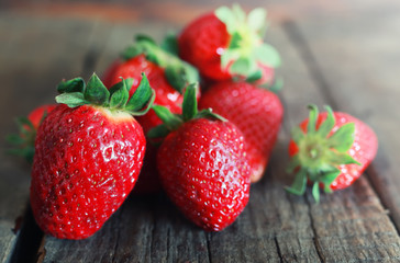 fresh strawberries on a wooden background