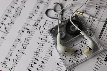 notes background and headphones