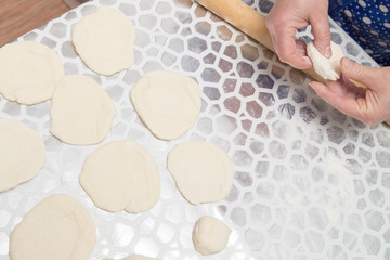 cooking cakes of the dough in the kitchen