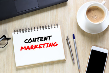 Top view of Content Marketing wording on office desk with notebook