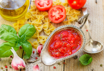 Homemade tomato sauce for pasta and meat from fresh tomatoes with garlic, Basil and spices. Selective focus
