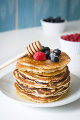 American pancakes with raspberries and blueberries
