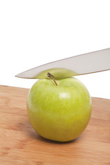 green apple with knife