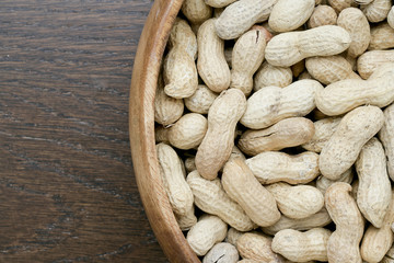 wooden bowl with peanuts