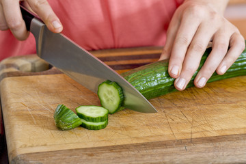 hand slicing bitter gourd