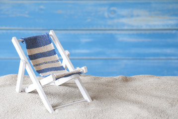 Fototapeta na wymiar Summer Greeting Card With Deck Chair And Sand