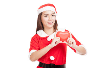 Asian Christmas girl with Santa Claus clothes with red heart