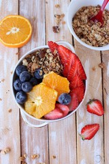 Coconut granola with berries, goji berries, nuts