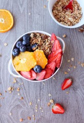 Coconut granola with berries, goji berries, nuts